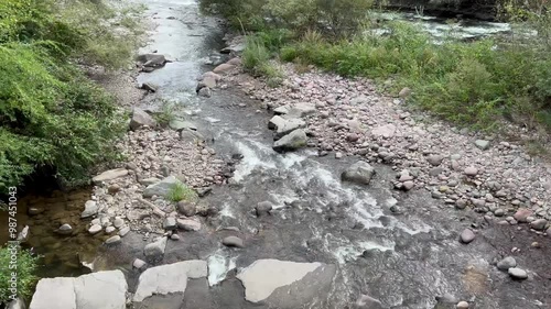 Arroyo junto al río Isarco en la ciudad de Bolzano, Italia photo