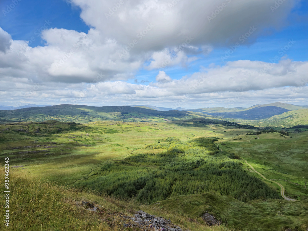 Green hills under blue summer sky landscape in Ireland Green hills under blue summer sky landscape in Ireland