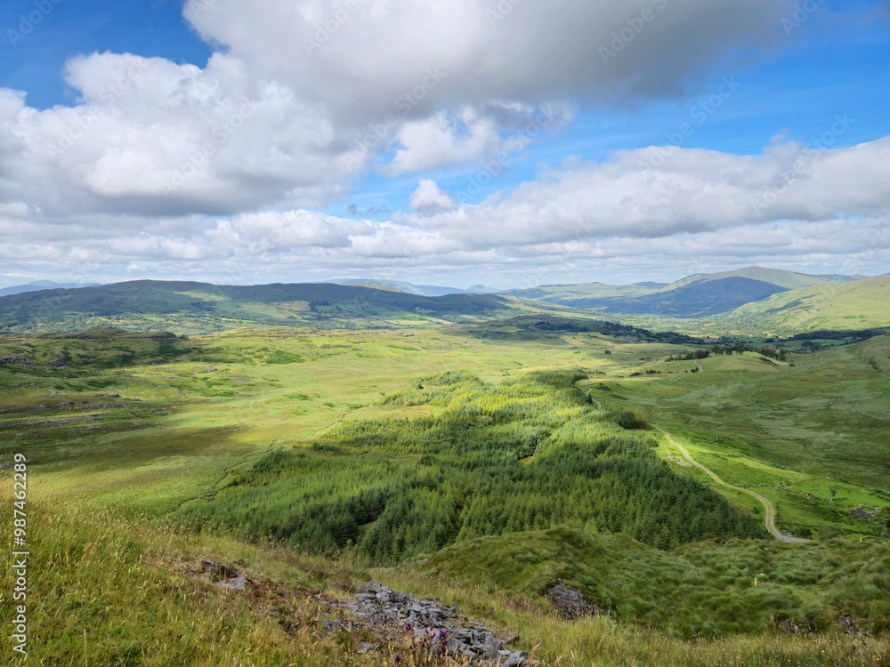 Green hills under blue summer sky landscape in Ireland Green hills under blue summer sky landscape in Ireland