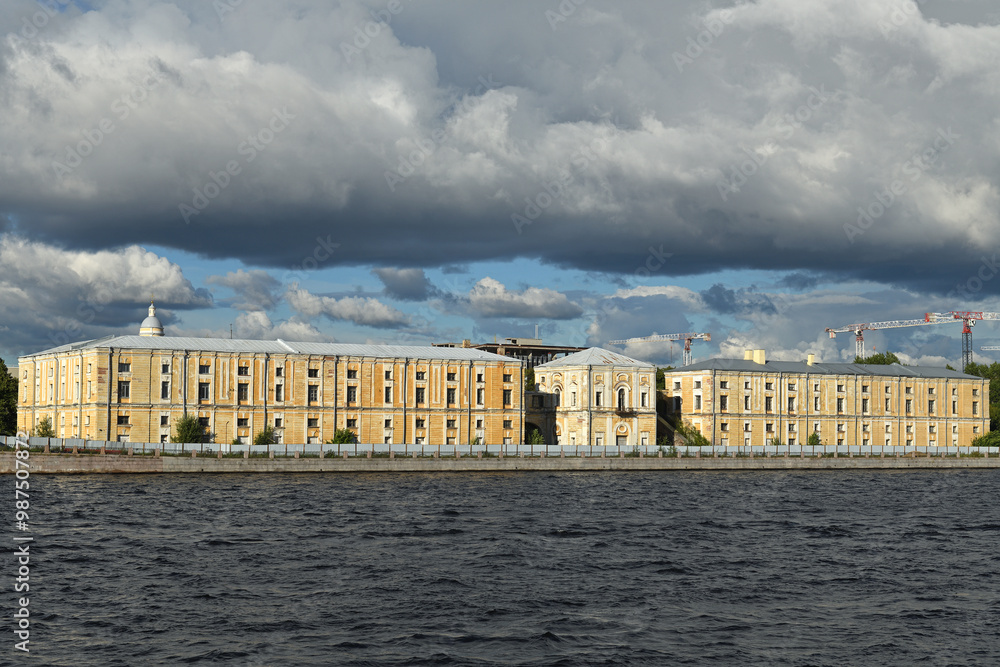 Fototapeta premium Tuchkov Buyan, monument of Petersburg architecture of early classicism, former stump warehouse building, on island of same name in channel of Malaya Neva. St Petersburg, Russia