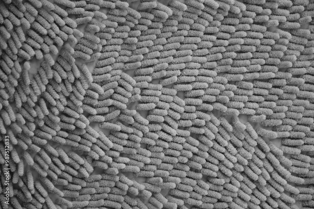 Processed image of fluffy gray doormat from bathroom in grey color Processed image of fluffy gray doormat from bathroom in grey color
