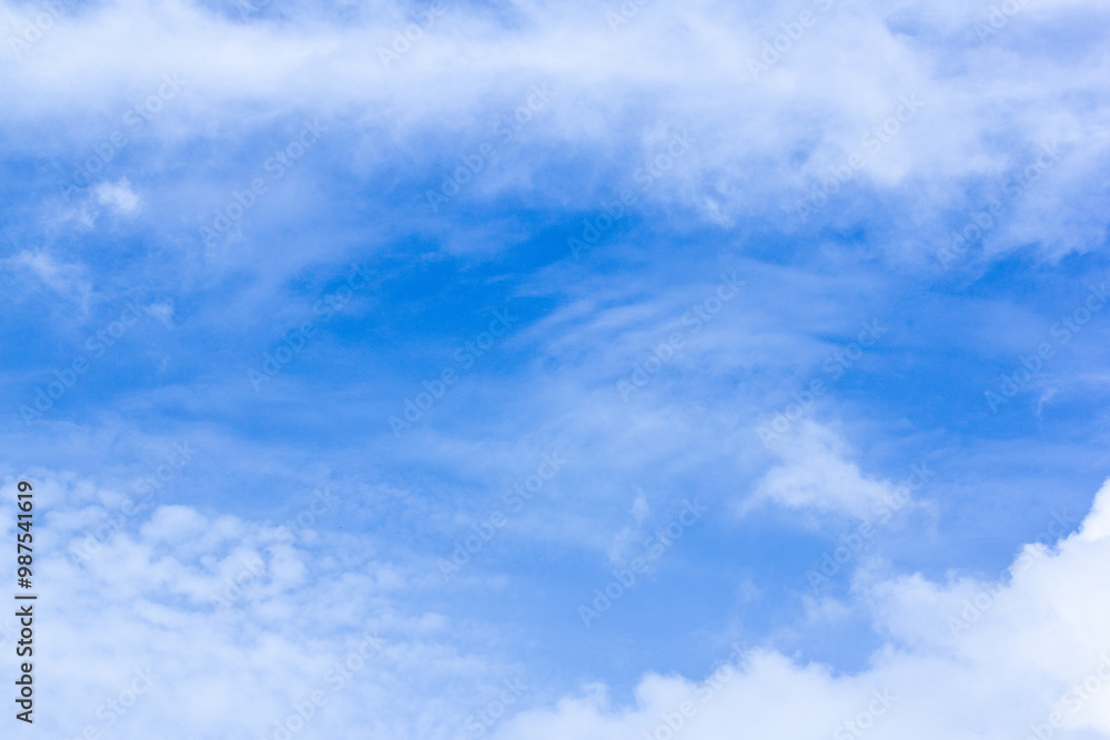 Fototapeta premium A Blue Sky With Clouds And The Sun Shining Through The Clouds