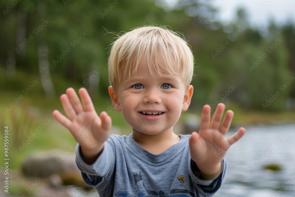 Friendly blonde child joyful and inviting home setting. Cute child blonde curls and joyful smile holding food. Joy of simple moments family environment. Friendly blonde child joyful and inviting home setting. Cute child blonde curls and joyful smile holding food. Joy of simple moments family environment.