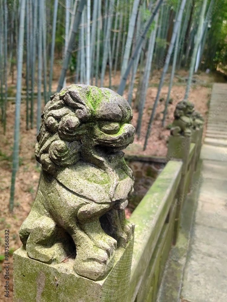 Close up of a lion stone statue in a park. Mythical creatures concept Close up of a lion stone statue in a park. Mythical creatures concept