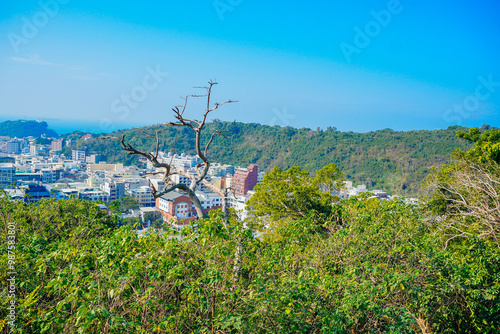 Kaohsiung, Taiwan, Republic of China, 01 25 2024: The landscape of Kaosiung port harbor, downtown, taiwan strait, and shoushan mountain  photo