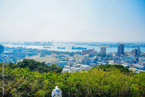 Kaohsiung, Taiwan, Republic of China, 01 25 2024: The landscape of Kaosiung port harbor, downtown, taiwan strait, and shoushan mountain  photo