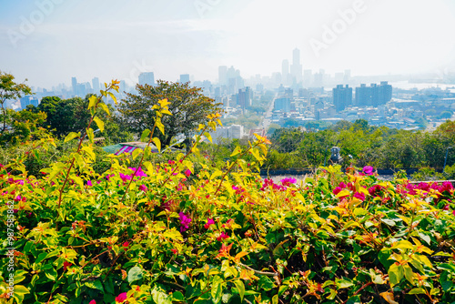 Kaohsiung, Taiwan, Republic of China, 01 25 2024: The landscape of Kaosiung port harbor, downtown, taiwan strait, and shoushan mountain  photo