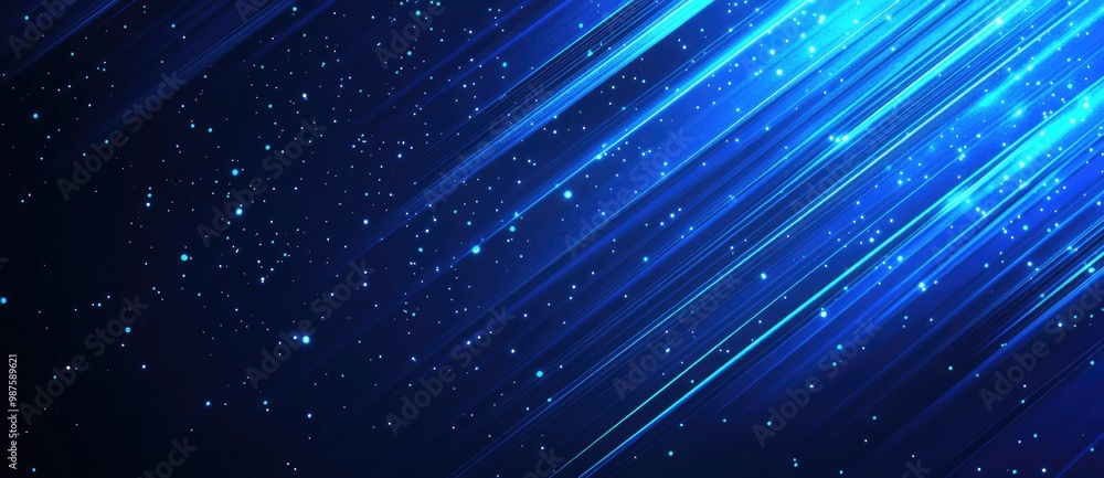 Obraz premium A dynamic blue background with light streaks and sparkling particles, creating a cosmic effect.