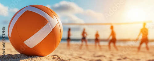 A vibrant volleyball rests on sandy beach, capturing joy of summer photo