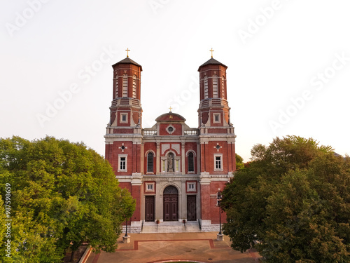 Shrine of St. Joseph Catholic Cathedral Church in Downtown Saint Louis, Missouri with green trees.