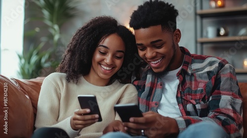 Browsing social media, a young couple shares and comments on posts while sitting together.