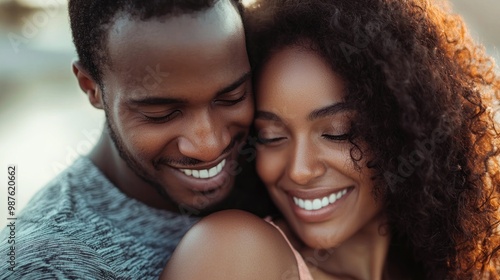 Embracing each other romantically, a young couple shows their affection and closeness.