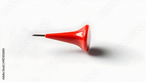 Solitary Scarlet Push Pin Contrasting with Clean White Background photo