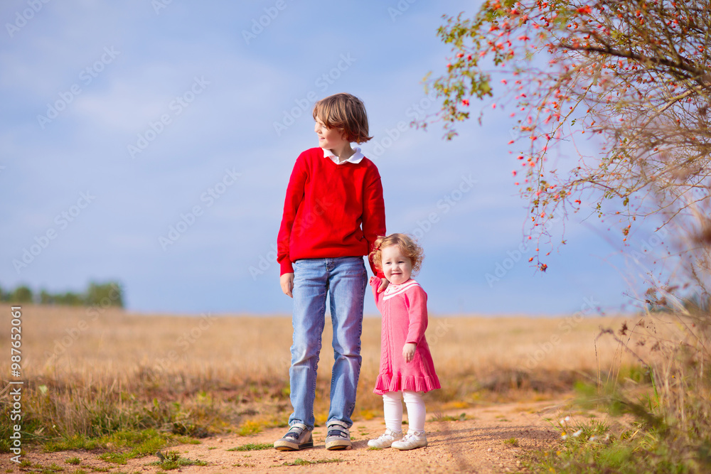 Fototapeta premium Kids playing in autumn park