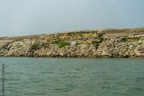 Obraz na płótnie Sandbags, geobags to protect riverbank from erosion and flooding. Bangladesh, Padma River. w salonie
