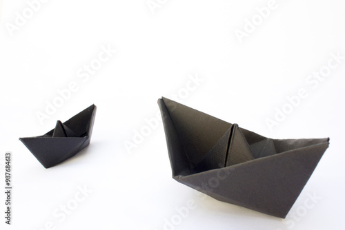 Folded Nighttime Mini Boats:Two black boat gliding on imaginary waters.