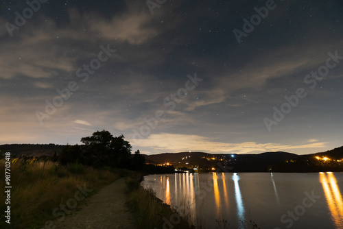 Landscape astrophotography on the Sola river at night in summer.