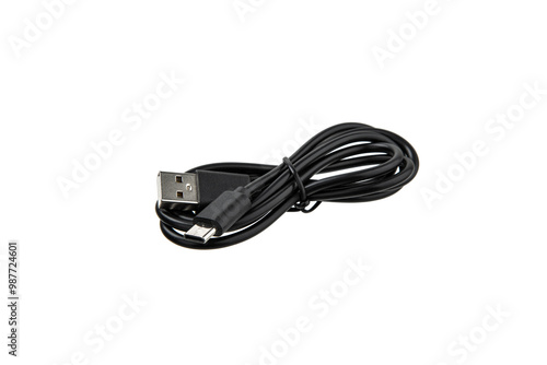 Fotografie A black USB cable is coiled up on a white background