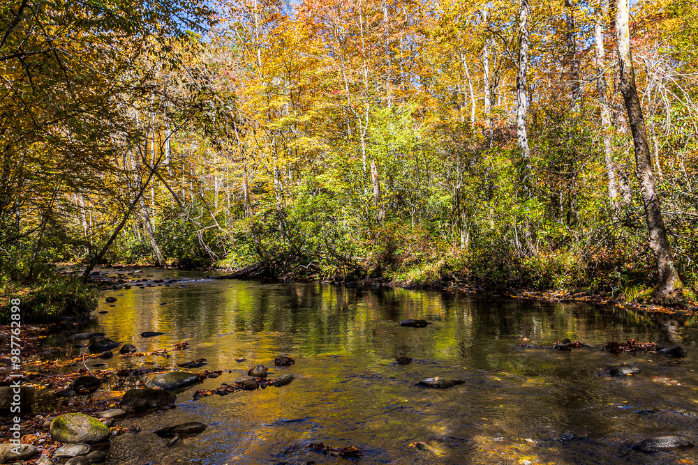 Autumn scenery along the Oconaluftee River at Great Smoky Mountains National Park. Autumn scenery along the Oconaluftee River at Great Smoky Mountains National Park.