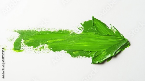 A green paintbrush stroke that looks like a green arrow photo