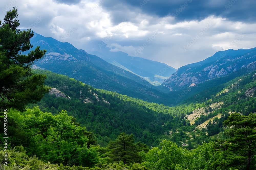 Panoramic View of Lush Green Mountain Valley with Dramatic Clouds Panoramic View of Lush Green Mountain Valley with Dramatic Clouds