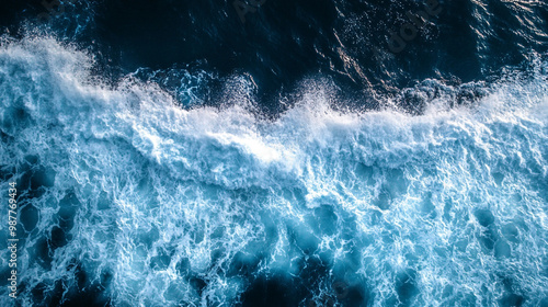 Topdown aerial shot of waves building up and breaking as they hit the shore, Drone view. Beautiful Winding Winter River.