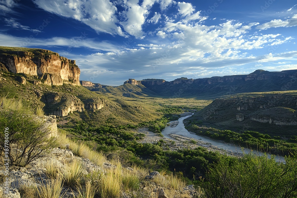 Naklejka premium Scenic View of a River Winding Through a Mountain Valley