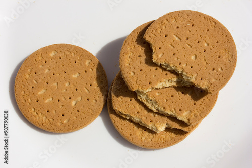 A stack of Indonesia biscuits in a white plate, with a soft and tasty milky flavor for a luxurious bite. photo