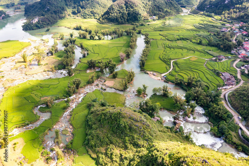 Aerial landscape in Quay Son river, Trung Khanh, Cao Bang, Vietnam with nature, green rice fields and rustic indigenous houses photo