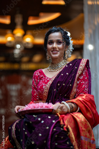 Radiant Grace: A Smiling Marathi Woman with a Puja Plate in Traditional Attire photo