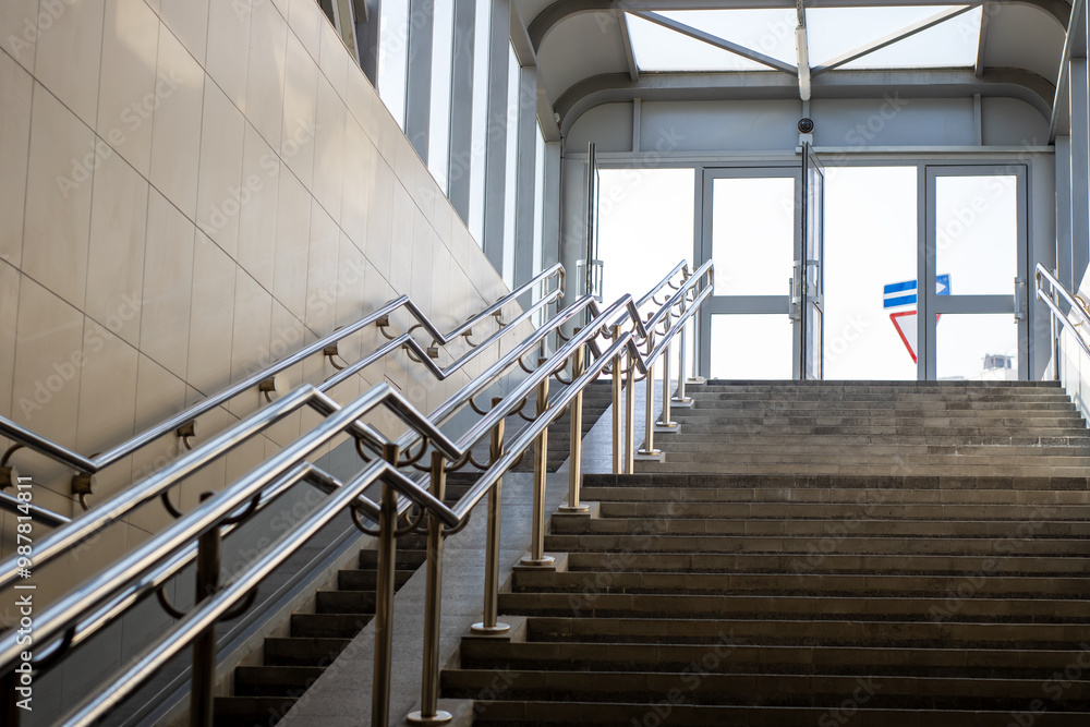 A beautiful set of stairs featuring a sleek stainless steel railing A beautiful set of stairs featuring a sleek stainless steel railing