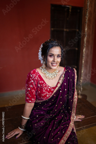 Traditional Elegance: A Marathi Woman Smiling in a Beautiful Nauvari Saree photo