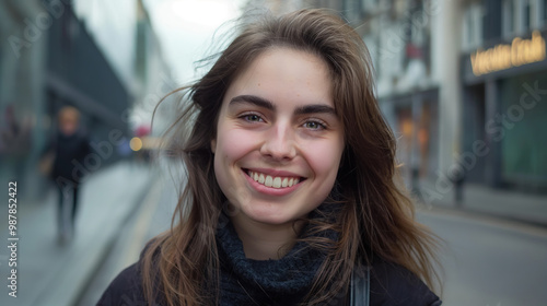 A woman with a warm smile enjoys the festive atmosphere of Boxing Day in the city