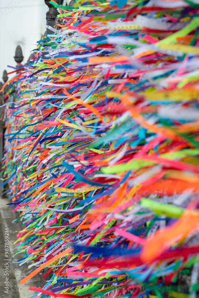 Several colorful ribbons of remembrance attached to the fence of the Senhor do Bonfim church in the city of Salvador, Bahia. Several colorful ribbons of remembrance attached to the fence of the Senhor do Bonfim church in the city of Salvador, Bahia.