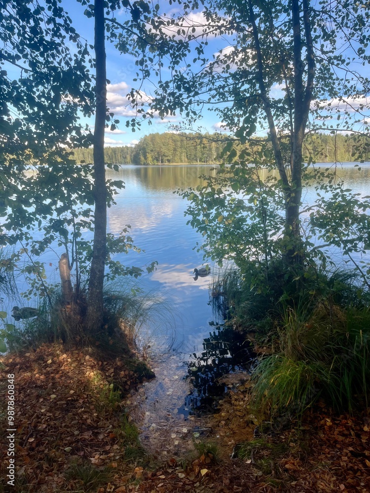 Obraz premium beautiful blue lake view, blue sky with white clouds reflections on the lake surface
