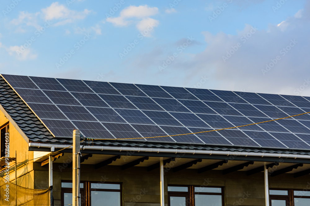 Solar panels on roof of residential house. Clean energy. Ecological concept Solar panels on roof of residential house. Clean energy. Ecological concept