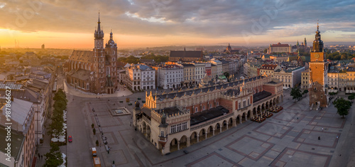 Aerial view of Main Square with St Mary's church and Cloth Hall in Krakow, Poland, during colorful sunrise