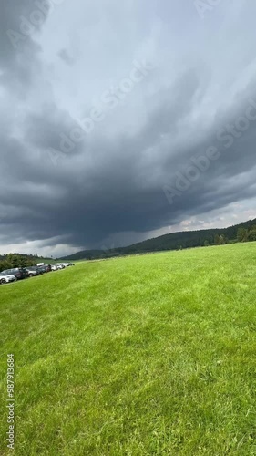 Low Perspective of Green Grass Under Dramatic Sky