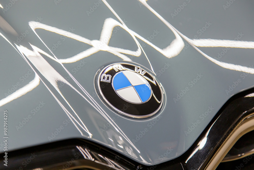BMW XM logo on gray car Hood and black kidney grille closeup. Emblem of ...