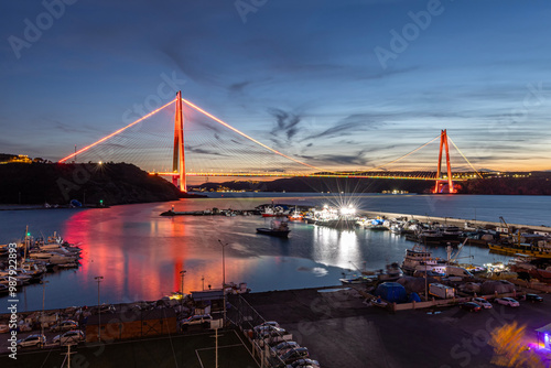 Sunset view of Yavuz Sultan Selim Bridge. Yavuz Sultan Selim Bridge in Istanbul, Turkey in evening illumination. 3rd Bosphorus Bridge night view from Poyraz. photo