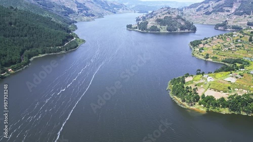 Tranquil Lake Victoria framed by majestic mountains, Africa, Uganda