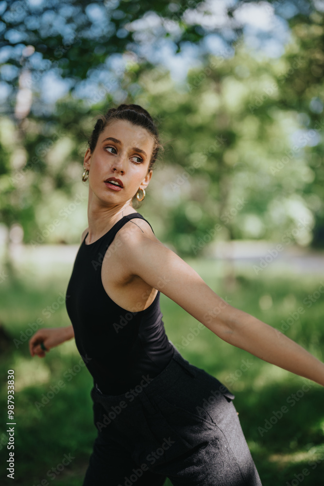Lovely girl dancing in nature, showcasing her graceful movements and expressing artistic beauty in a natural setting. Lovely girl dancing in nature, showcasing her graceful movements and expressing artistic beauty in a natural setting.