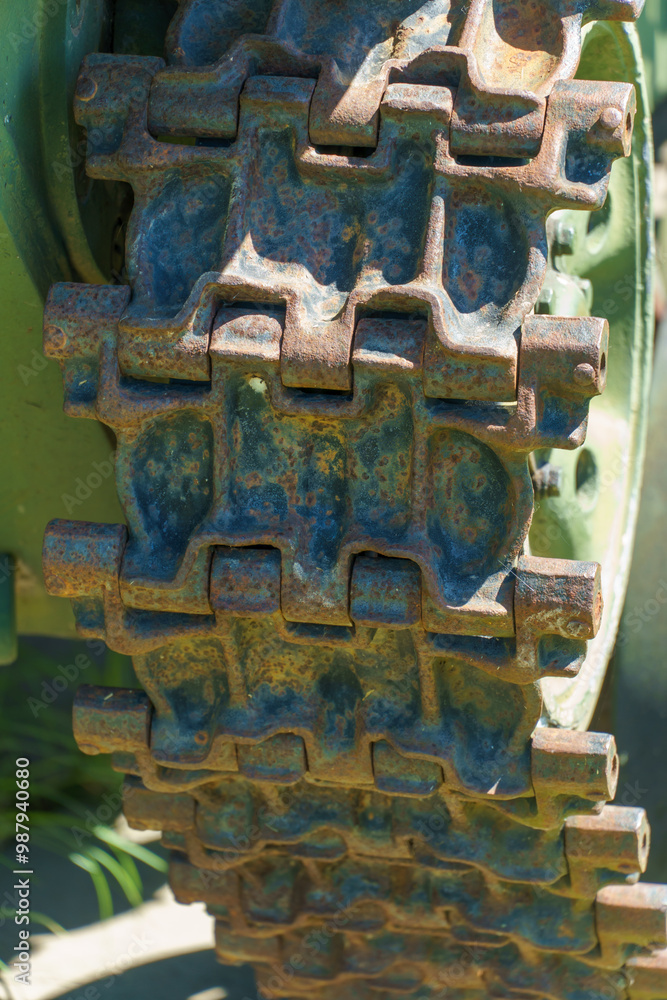 Fototapeta premium A Soviet military tank. Dynamic protection on the tank body. Elements of an armored vehicle in close-up, tracks and a cannon.