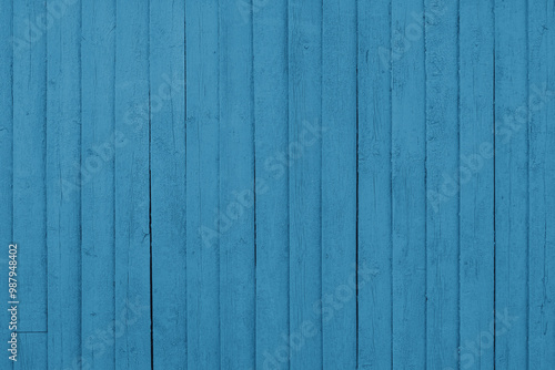 Distressed cracked wooden vertical blue painted plank texture background