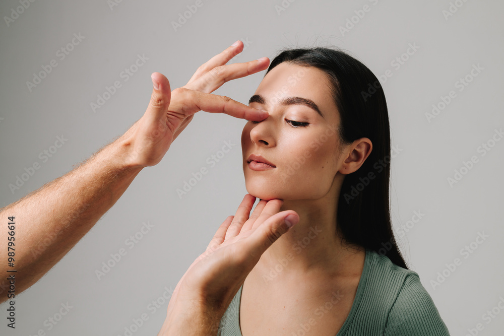 Obraz premium Rhinoplasty. Young woman wants to change appearance of nose and improve breathing. Patient needs to alter bone, cartridge and skin of nose with rhinoplasty surgery.