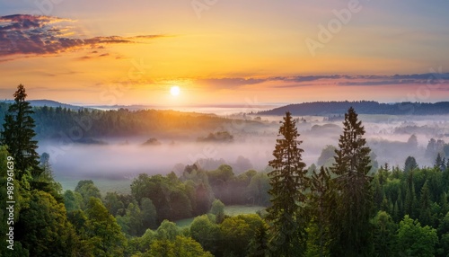 Amazing Sunrise Over Misty Landscape. Scenic View Of Foggy Morning Sky With Rising Sun Above Misty Forest. Middle Summer Nature Of Europe