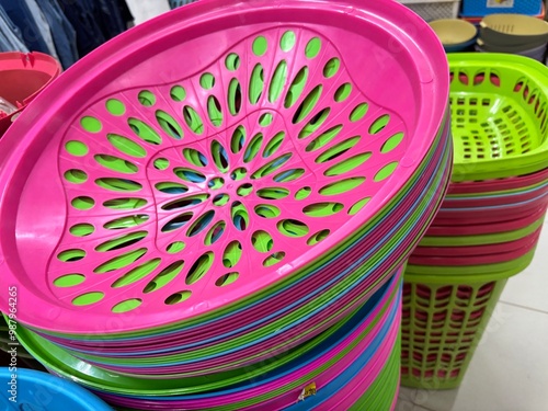 Bontang, East Kalimantan, Indonesia - 21 September 2024 : Various products neatly arranged on shelves for sale in an Indonesian minimarket. Toys, books, kitchen utensils, baskets, water bottles, tooth photo