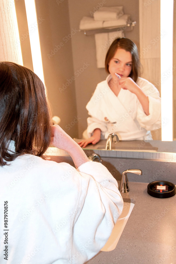 Beautiful girl in a Bathrobe posing in the interior of the room. Portrait of a cute beautiful girl in a white towel and Bathrobe. The morning of the procedure. High quality photo Beautiful girl in a Bathrobe posing in the interior of the room. Portrait of a cute beautiful girl in a white towel and Bathrobe. The morning of the procedure. High quality photo
