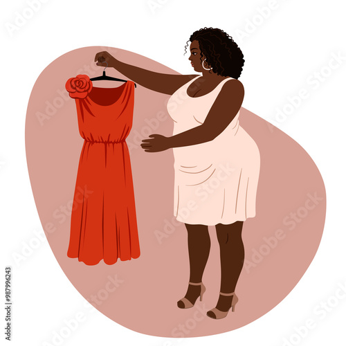 sexy chubby african american woman holding orange dress in hands