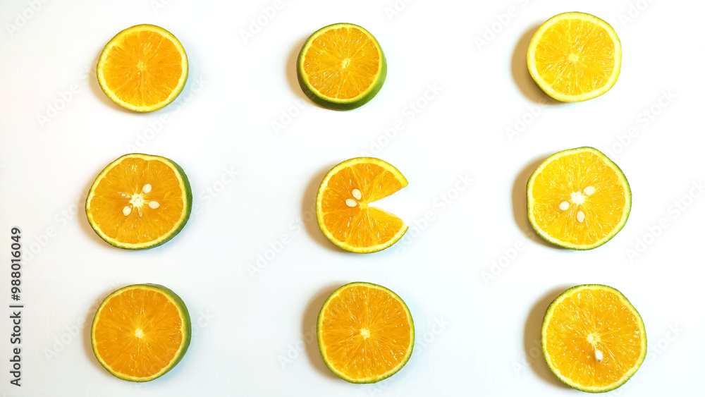 Slices of fresh orange on the White background.
Slices of fresh orange on the White background.